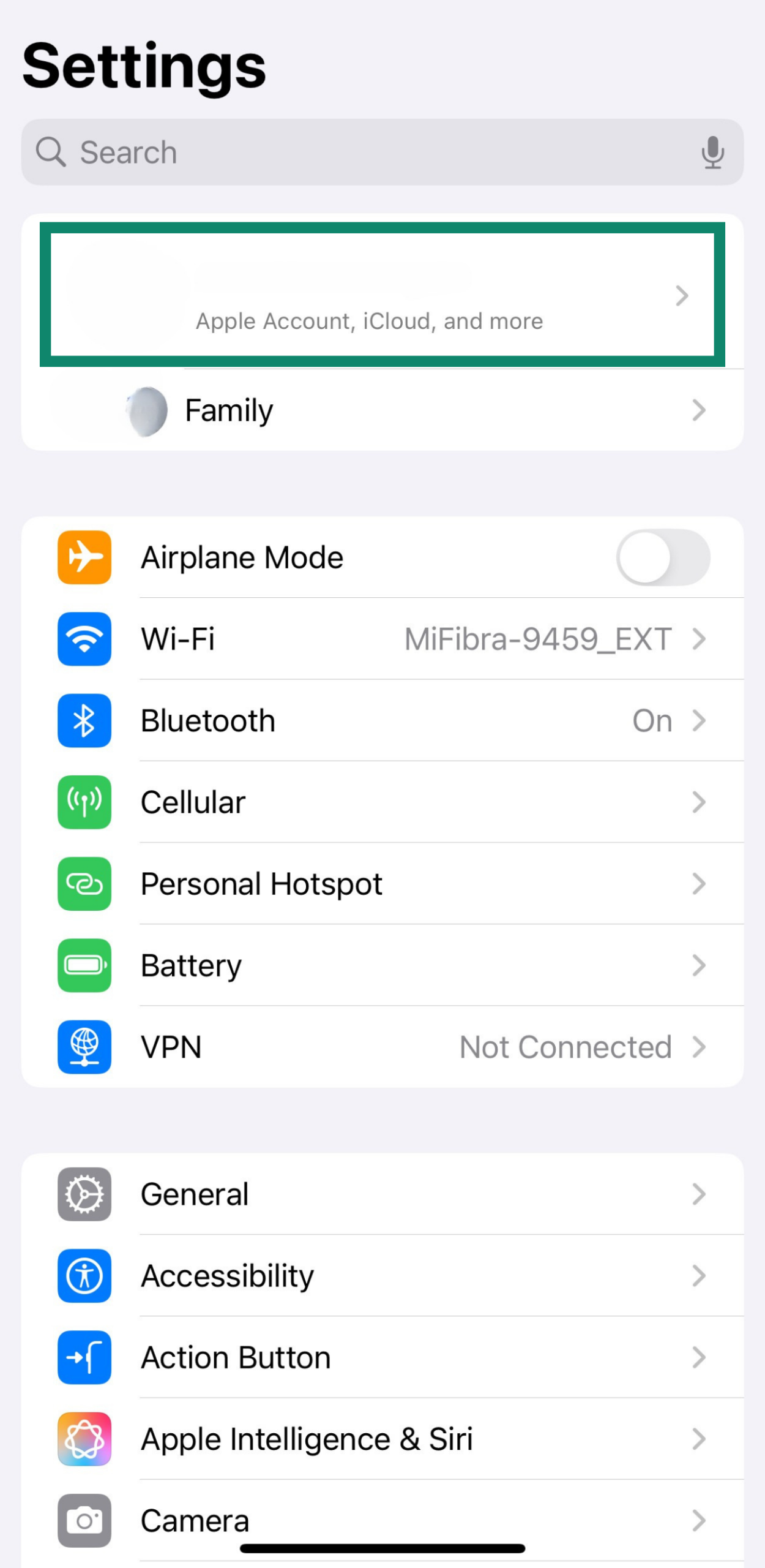 iPhone Settings screen with Apple ID option highlighted