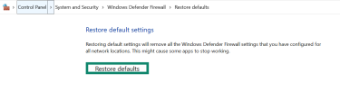 The "Restore default settings" confirmation screen in Windows Defender Firewall, showing the "Restore defaults" button.