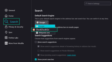 The Firefox settings showing the Search tab with DuckDuckGo selected as the default search engine in the dropdown menu.