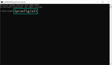 Command prompt with ipconfig /all typed to display network configuration